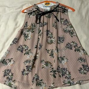 Pink flowy top with black detail and tie at the neck